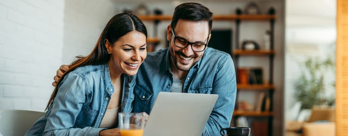 Couple looking at a laptop