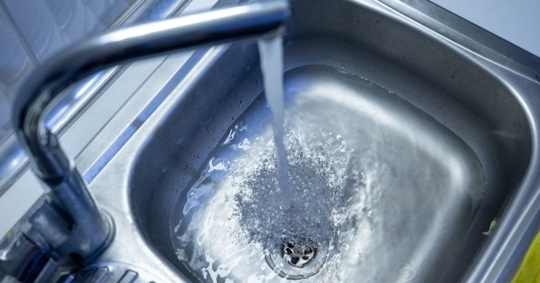 Water draining slowly from the sink