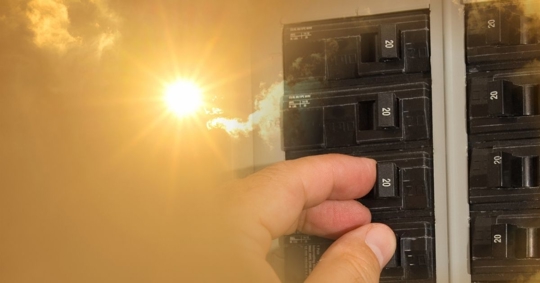 electrical panel with extreme summer heat in the background