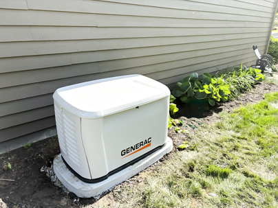 Generac residential standby generator installed beside a Central Ohio home