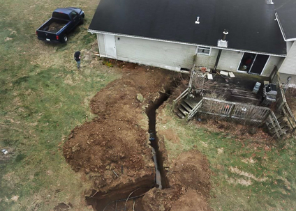 Geothermal ground-loop header piping entering a Central Ohio home